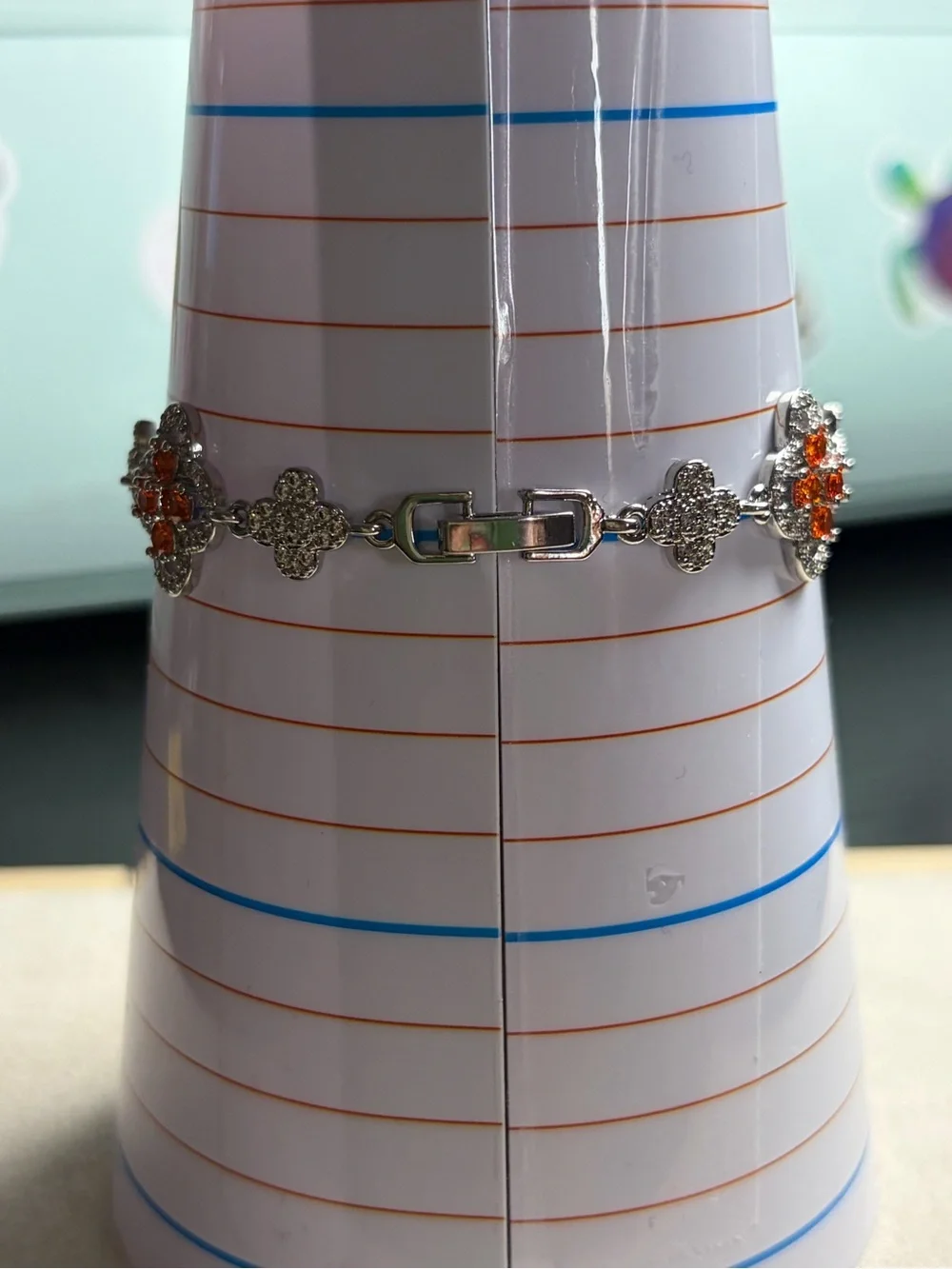 Silver Floral Bracelet with Orange Crystal Accents